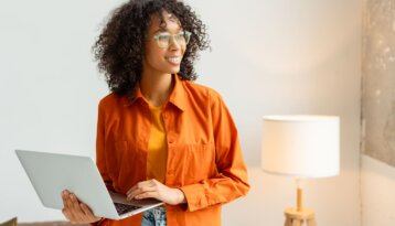 Portrait of a female coworker in an orange jacket